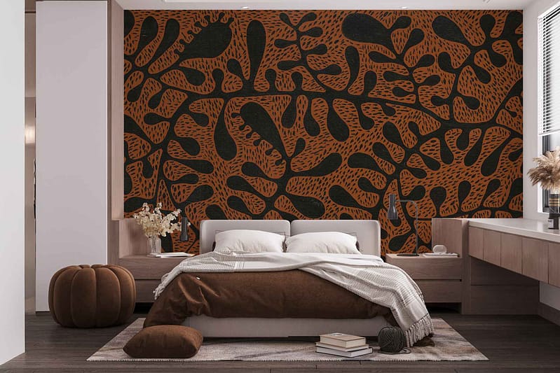 Abstract wallpaper featuring a black and orange leafy pattern.
