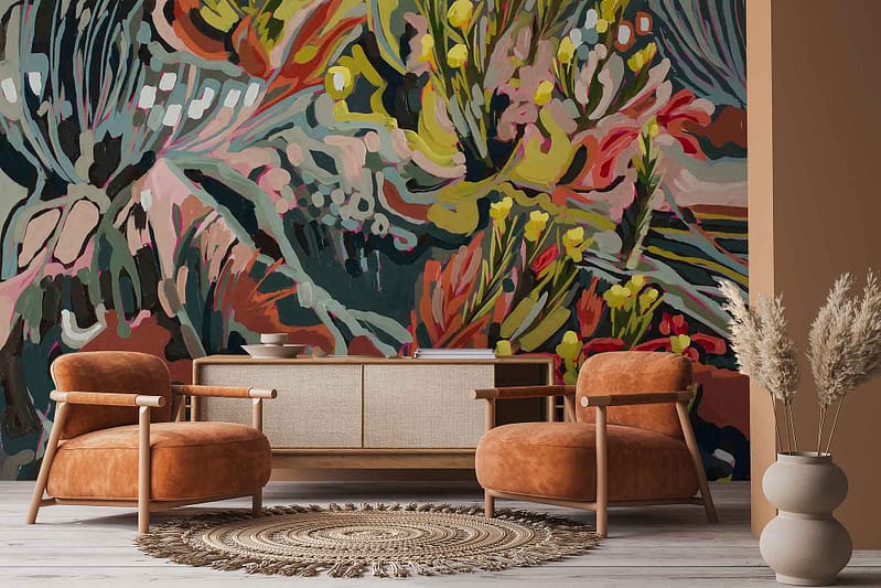 Colorful abstract floral wallpaper inspired by the Amplify series, featuring bold blooms, dynamic brushstrokes, and a vibrant mix of red, pink, blue, yellow, and green hues in a modern design.