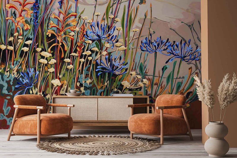 Vibrant floral mural wallpaper featuring colorful wildflowers such as Agapanthus in shades of blue, pink, purple, yellow, and green. Lush botanical patterns and vivid colors dominate the design.