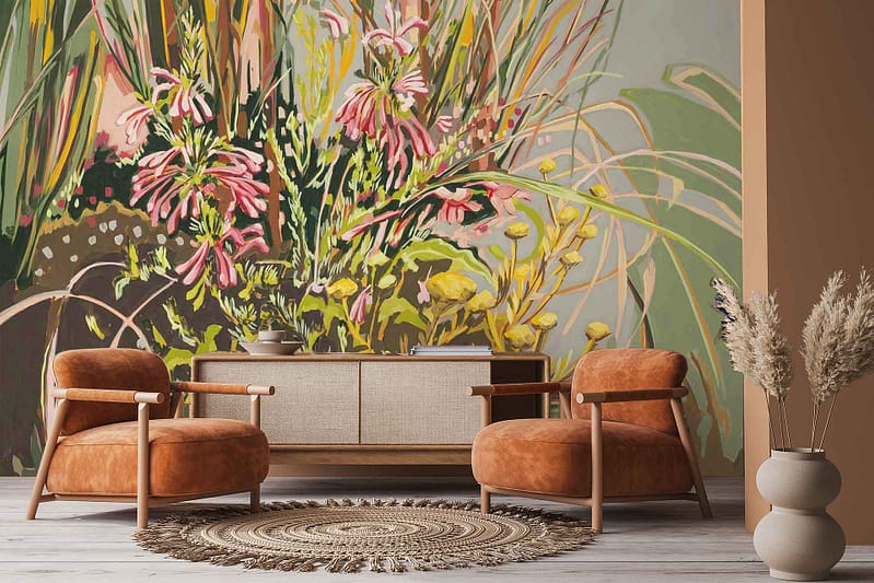 Colorful floral mural wallpaper with prominent pink and yellow flowers and vibrant green leaves.