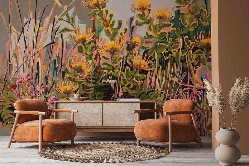 Large, colorful floral wallpaper featuring vibrant Pincushion blooms in shades of orange, yellow, and red with lush green foliage; mural dominates the wall as a striking decorative element.