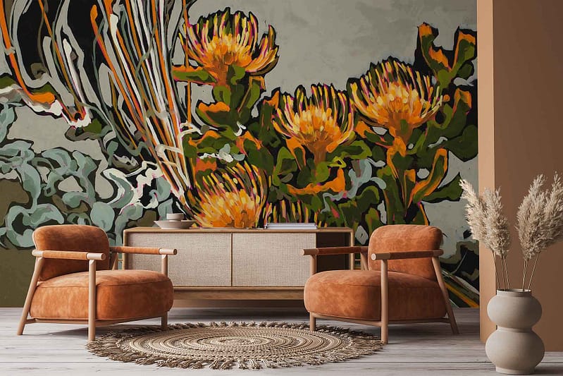Bold, colorful floral wallpaper with large orange and yellow blooms, abstract green foliage, Pincushions, and Helichrysum leaves. The mural features vibrant botanical elements in warm and green tones.