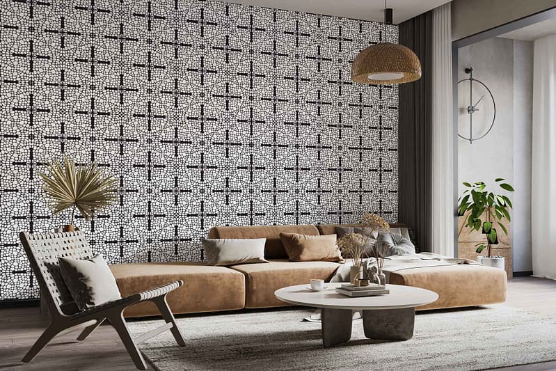 The accent wall in the modern living room features a geometric wallpaper with overlapping tan, cream, and warm brown shapes. Subtle tortoise shell patterns blend into the design, infusing earthy amber and dark chocolate tones into the neutral palette. The pattern’s organic curves echo mid-century motifs while maintaining a minimalist feel. This distinctive wallpaper brings cozy warmth and visual depth to the space.