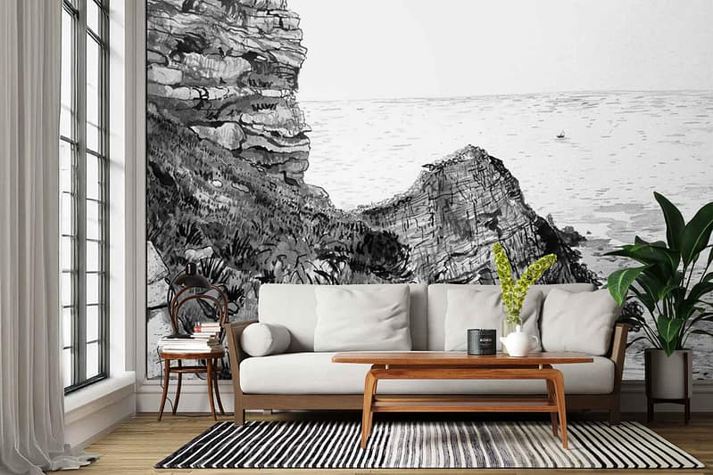 Top Of The Station mural wallpaper features dramatic rocky cliffs and a vast sea, all in grayscale tones—ranging from deep charcoal rocks to misty grays and soft white highlights. The scene evokes rugged coastal landscapes, with textured cliff faces, swirling clouds, and a sense of moody natural grandeur, entirely in black, white, and gray.