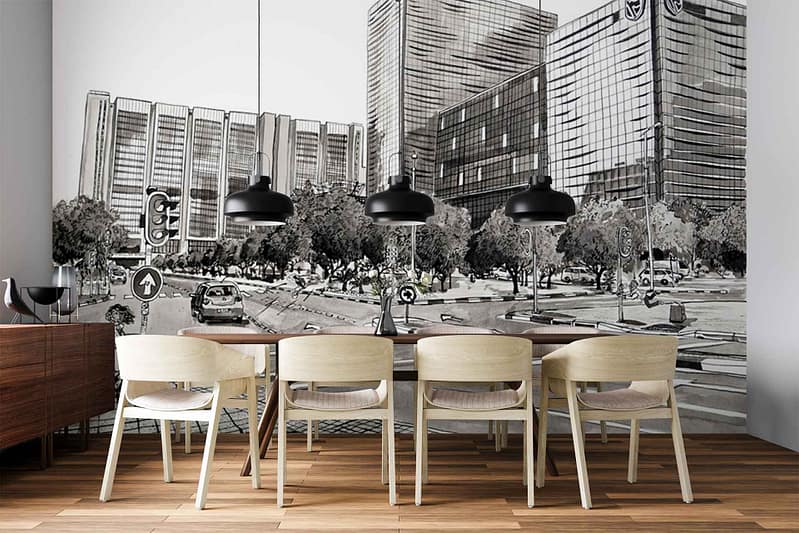 Black-and-white wallpaper mural featuring a detailed cityscape with tall buildings, cars, and trees. Architectural lines, urban skyline silhouettes, monochrome shades—no color except grayscale.