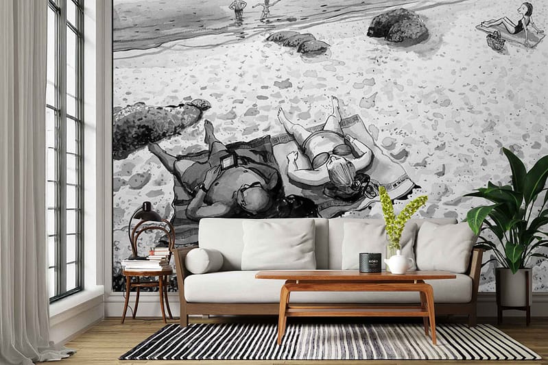 Large black-and-white mural wallpaper depicting people relaxing on Clifton Beach; features beachgoers, umbrellas, relaxed poses, sandy shoreline, ocean waves, and iconic Table Mountain in the background; grayscale tones create a striking and timeless visual focal point.