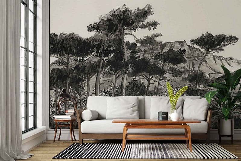 Black and white mural wallpaper featuring detailed trees and mountain landscapes. Monochrome color palette with intricate nature elements—tree trunks, branches, foliage, mountain peaks—sketched or painted in grayscale tones.