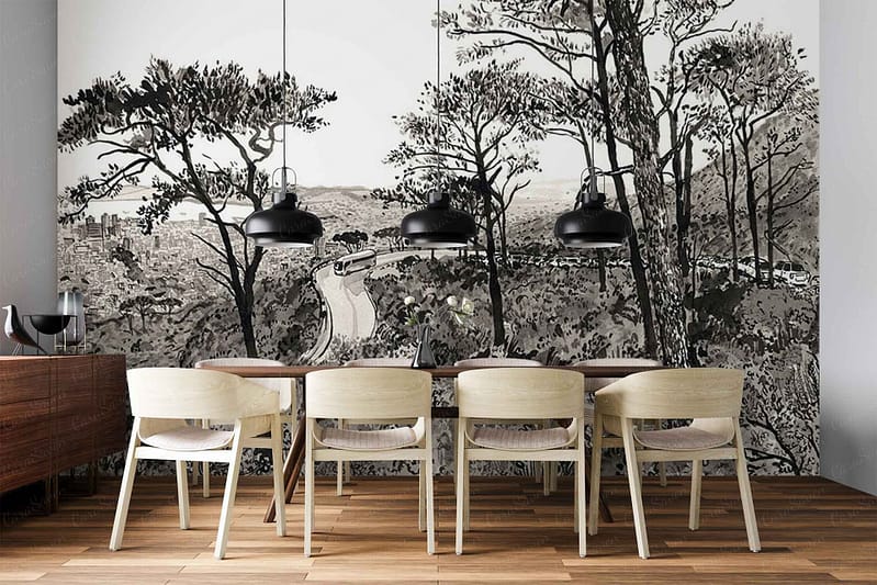 Black and white wall mural featuring a forest landscape. The wallpaper shows tall, slender trees with detailed branches and trunks in varying shades of gray. A winding road or path curves through the scene, creating depth. The overall palette is monochrome, using blacks, whites, and grays to depict the natural scenery and evoke a serene woodland atmosphere.