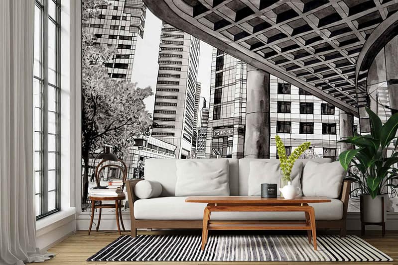 The wallpaper is a large black-and-white mural depicting urban skyscrapers and detailed city architecture. Elements include high-rise buildings, classic facades, arched windows, and intricate detailing that evoke an Old Town House charm. Monochrome tones of black, white, and gray dominate the mural’s color palette.