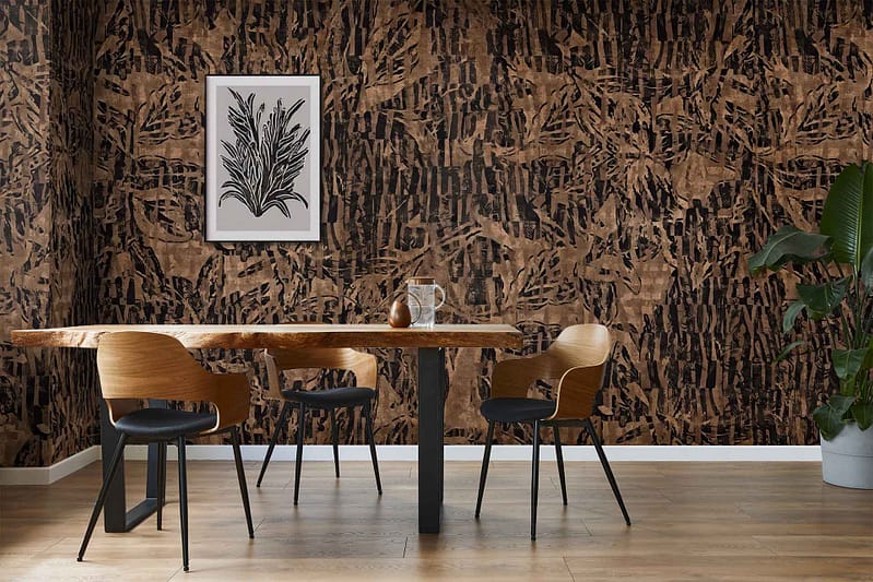 Abstract brown patterned wallpaper featuring organic, flowing shapes in various shades of brown, taupe, and beige. The design includes overlapping curves and subtle geometric accents, creating a modern and textured visual effect with rich earth tones.