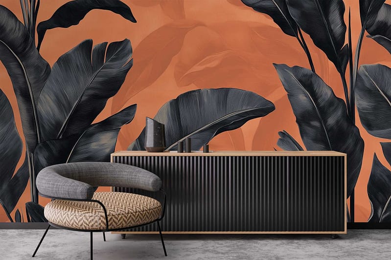 The wallpaper features a bold orange background accented with large, dark tropical leaves and subtle animal illustrations integrated into the design. The colors are primarily deep greens and blacks for the foliage, contrasted against the vivid orange, with faint outlines of animals adding delicate detail.
