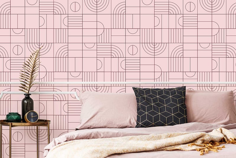 Modern bedroom wallpaper features a pink geometric pattern, showcasing varying shades of pink with crisp white lines forming triangles and diamonds. The design combines soft blush, rose, and hot pink hues that create a bold, contemporary statement.