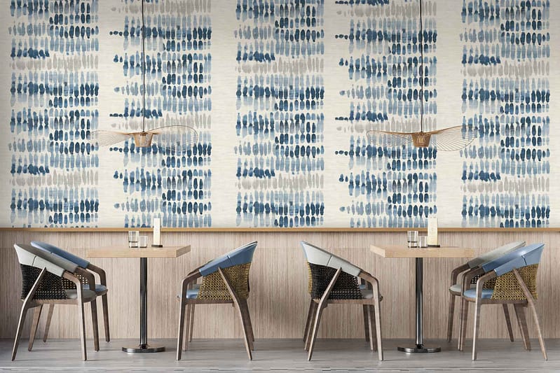 Wallpaper features a bold blue and gray abstract pattern with fluid, overlapping shapes and subtle texture. The design includes varying shades of blue—from deep navy to light sky—and gradients of cool gray, creating depth and visual interest. No other colors or motifs are present; the focus is entirely on the interplay between blue and gray in an organic, modern composition.