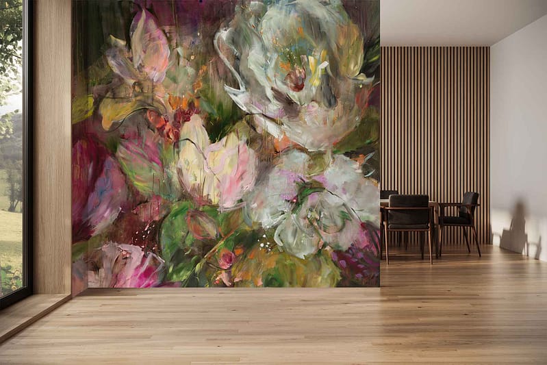 The wallpaper features a bold, colorful abstract floral mural with sweeping brushstrokes in vivid hues of magenta, cobalt blue, golden yellow, emerald green, and soft peach. Oversized petal and leaf shapes overlap dynamically on a white background, creating an energetic mix of organic forms that evoke modern floral art.