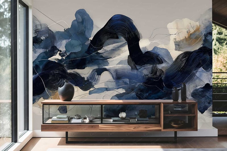 Large abstract mural wallpaper features dynamic swirls and bold strokes of deep blue, black, and hints of white. The design is expressive with brush-like textures, creating a sense of energy and movement. The contrasting dark and cool tones make the wall a striking focal point in the room.