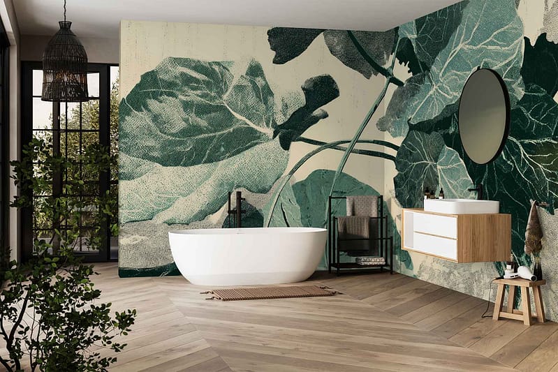 Large botanical leaf mural wallpaper features oversized green leaves, lush foliage patterns, and vibrant shades of green against a light background, creating a bold nature-inspired statement wall in the bathroom.