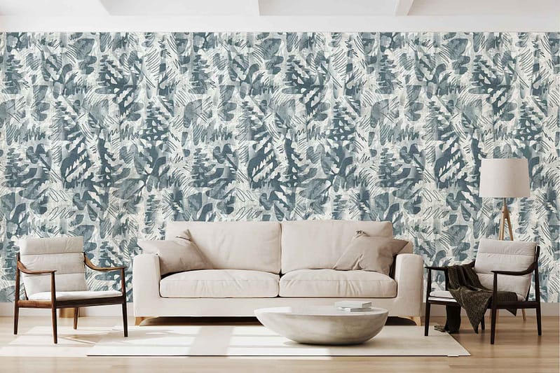 Bold blue and white leafy-patterned wallpaper spans the entire background wall, featuring large, intricate leaf designs in vibrant blue and crisp white tones.