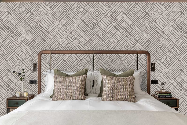 Meadowlands-inspired geometric-patterned wallpaper in the background features repeating shapes and lines in soft greens, blues, and neutrals, adding a modern touch to the space.