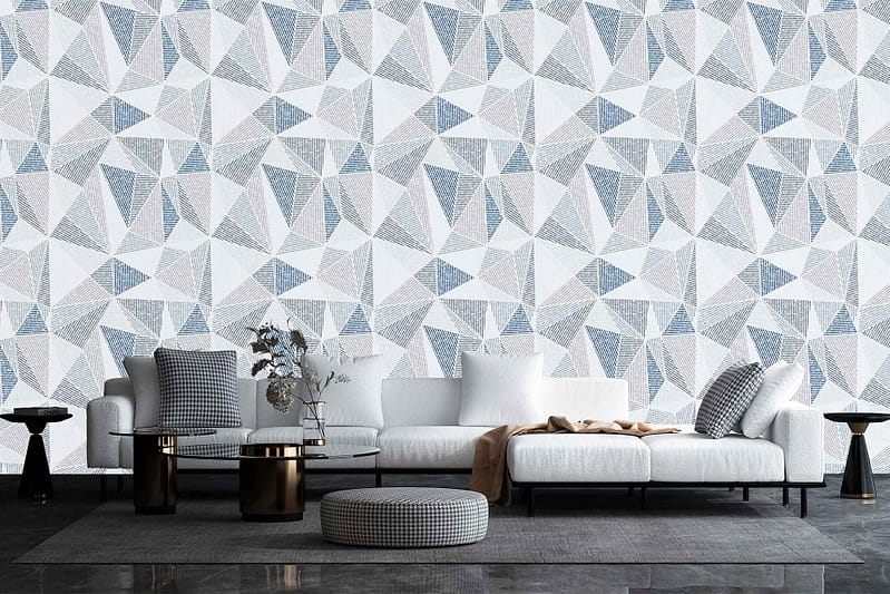 Geometric wallpaper in the living room featuring shades of gray, white, and blue with bold patterns and shapes.
