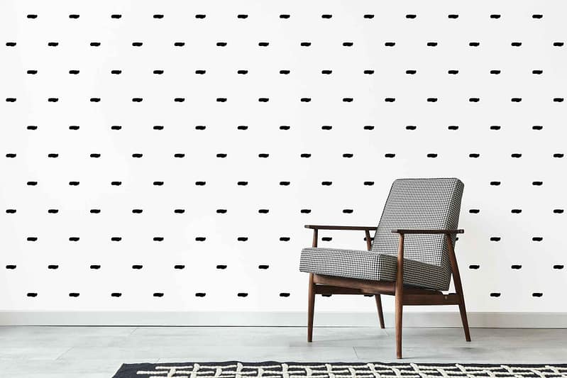 White wall wallpaper featuring a Fancy Nancy-inspired grid of small, irregular black dots.