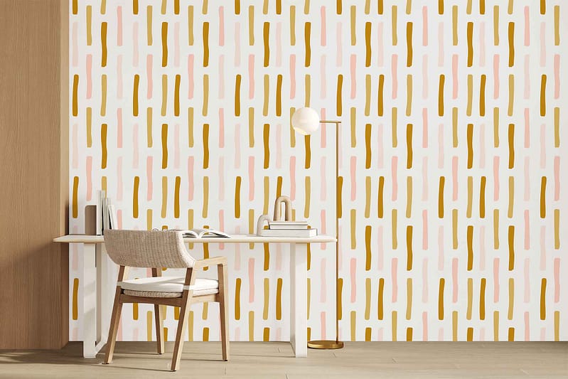 Wallpaper with vertical dashes in mustard yellow and pastel pink, arranged in a modern pattern on the wall.