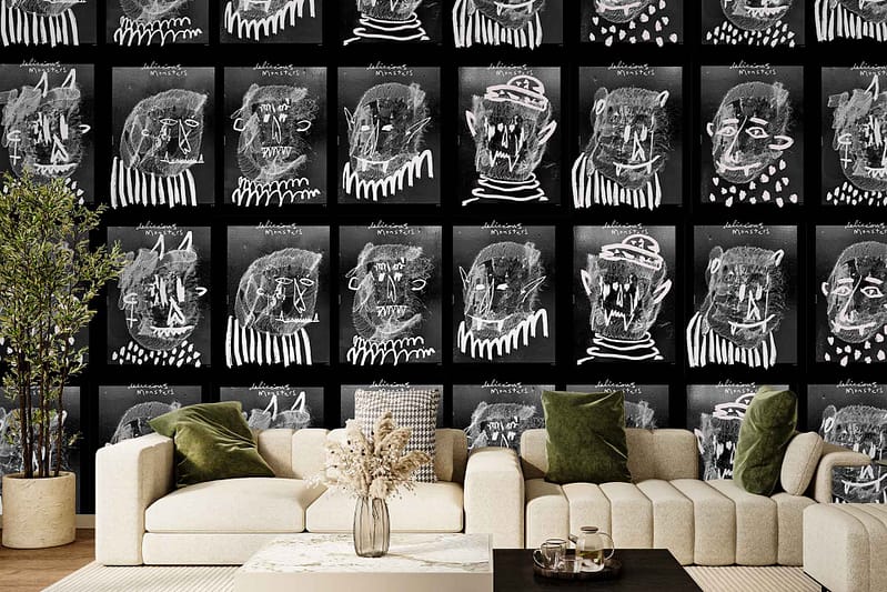 Black-and-white abstract face art wallpaper features bold faces and line drawings in monochrome tones, creating a striking modern backdrop.