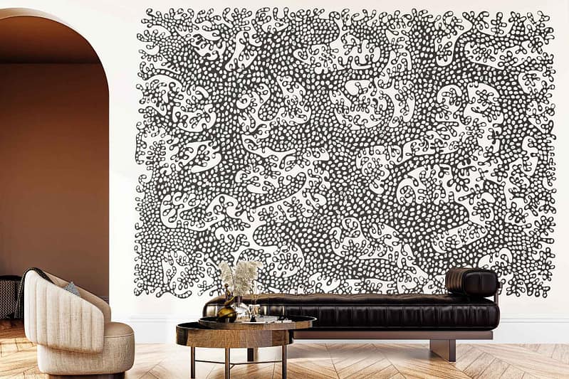 Black-and-white abstract mural with bold doodle-like patterns, featuring intricate lines and geometric shapes as the dominant wallpaper in the room.
