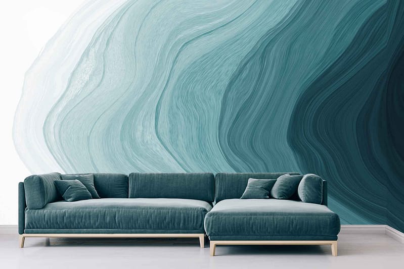 Abstract wall mural with swirling shades of blue and teal, featuring artistic patterns that evoke a calming, creative atmosphere. Blues and teals are prominent colors in the wallpaper design.