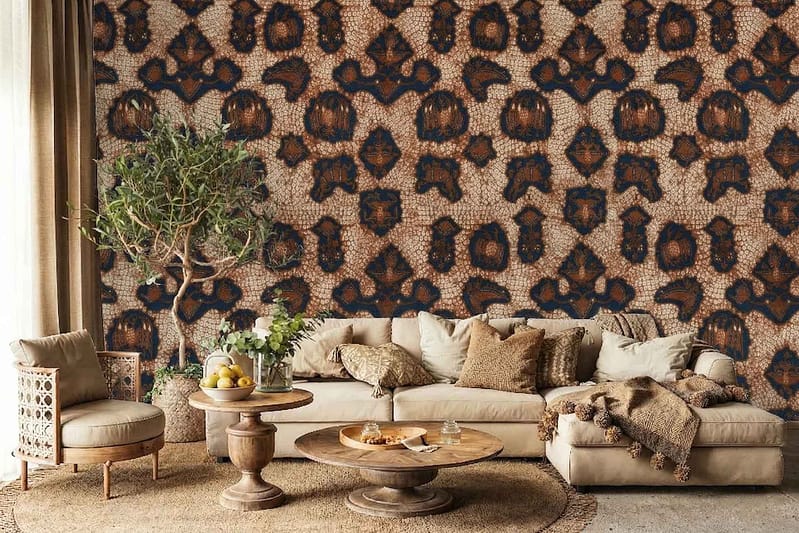 Bold Batik Brigade geometric wallpaper features intricate dark blue and brown patterns with sharp, repeating shapes.