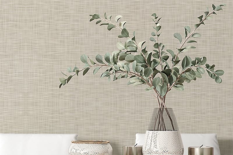 Textured beige wallpaper forms the background, featuring subtle variations in tone and a soft, modern finish.