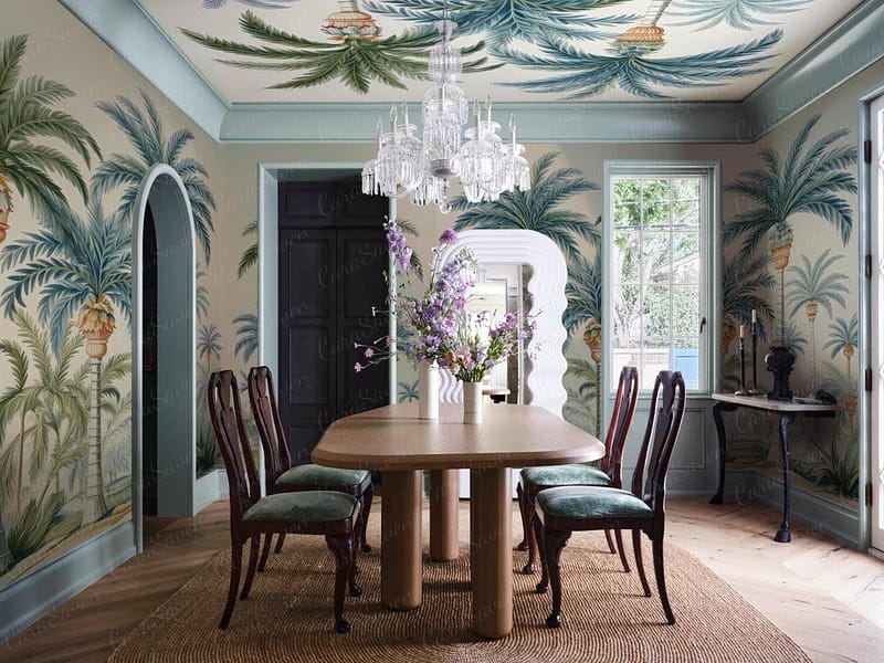 Wallpaper featuring lush green palm trees and vibrant parrots in shades of red, blue, and yellow. The background is an off-white, adding depth to the tropical elements. Hints of bright orange and teal accents enhance the exotic flair.