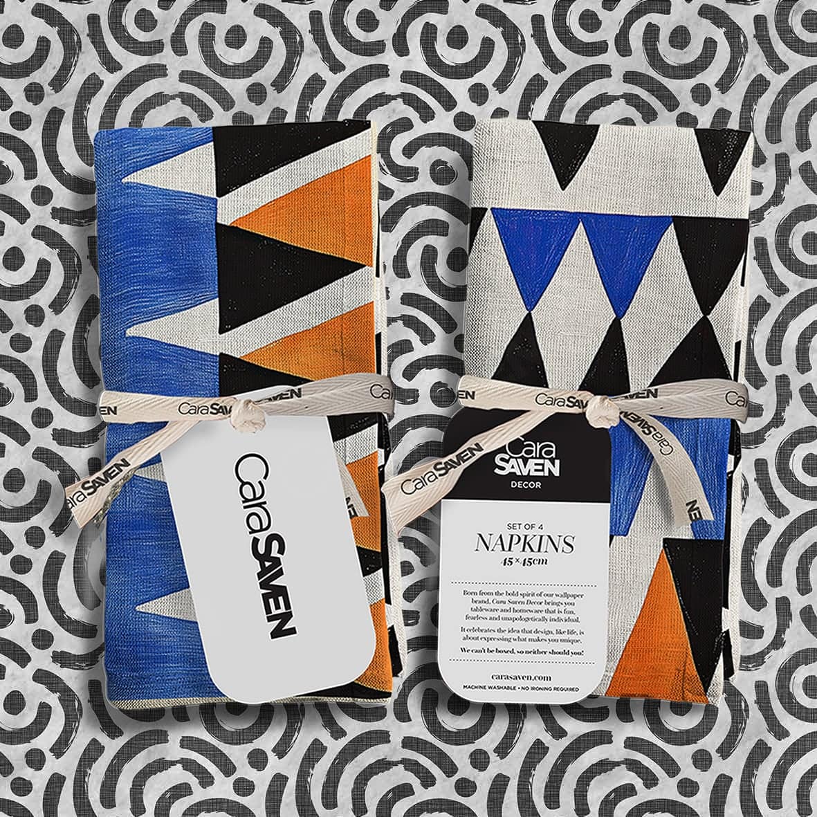 Striking Cara Saven designer wallpaper featuring bold black and white abstract patterns, with high-contrast, graphic shapes and organic flowing lines in monochrome.