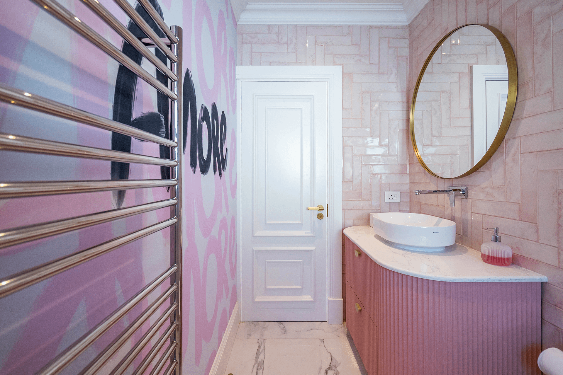 The wallpaper features a soft pink and white color palette with delicate, repeating patterns—think subtle geometric shapes and flowing lines. Among the motifs, the word "love" is elegantly scripted in various shades of pink throughout, adding a playful yet romantic touch. Touches of blush, rose, and pastel pink dominate the design; accents of white keep it fresh and modern.