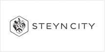 **Logo Description:**
- **Emblem:** Hexagonal shape featuring an abstract, elegant design.
- **Text:** "STEYN CITY" in uppercase letters positioned to the right of the emblem.
- **Color Scheme:** Black and white for a refined and elegant appearance.
**Wallpaper Elements:**
- Hexagonal pattern
- Abstract designs
- Black and white contrast
The emphasis on these elements ensures the logo exudes a sophisticated allure, akin to a dream home-themed carousel ride.