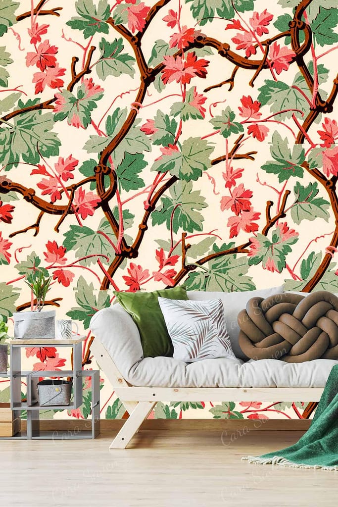 The wallpaper features vibrant red and green leaves on intertwining vines, adding a lively and natural touch to the room's ambiance.