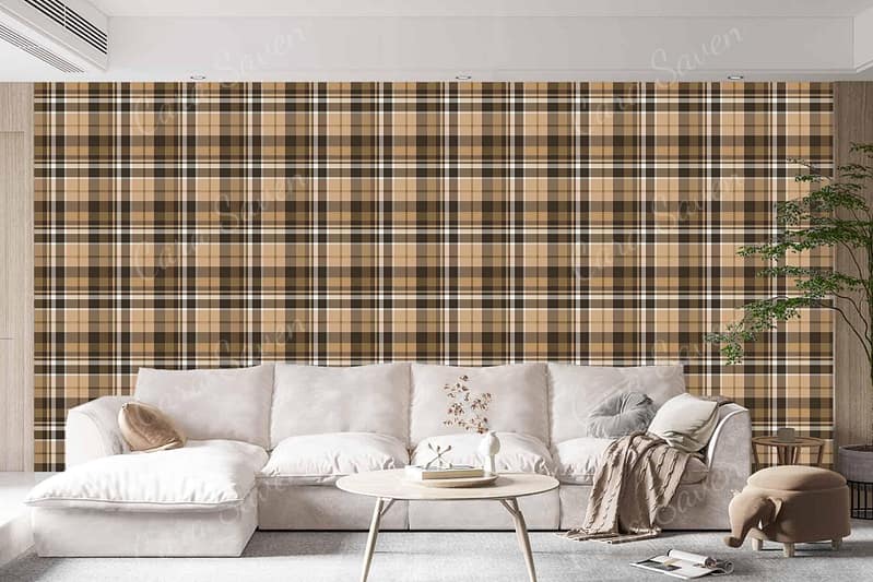 The wallpaper features a plaid pattern in shades of brown and beige. The design incorporates intersecting lines that create a classic, checkered effect. The color palette includes rich browns and soft beige hues, adding warmth and sophistication to the living room backdrop.