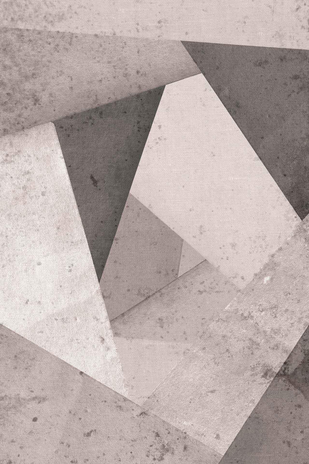 Abstract geometric wallpaper featuring overlapping triangles and quadrilaterals in various shades of gray. The textured, weathered appearance resembles aged concrete, enhancing the depth and complexity of the monochromatic design's sharp corners. Key elements include geometric shapes, textured surfaces, grayscale palette, and a concrete-like finish.