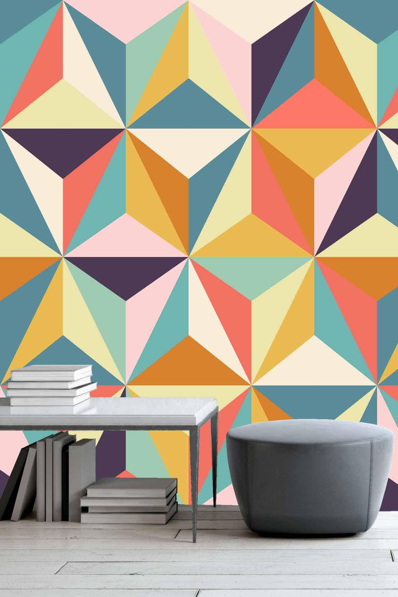 The wallpaper features bold, colorful triangles in shades of teal, orange, yellow, and pink. Designed to reflect creativity and vibrancy.
