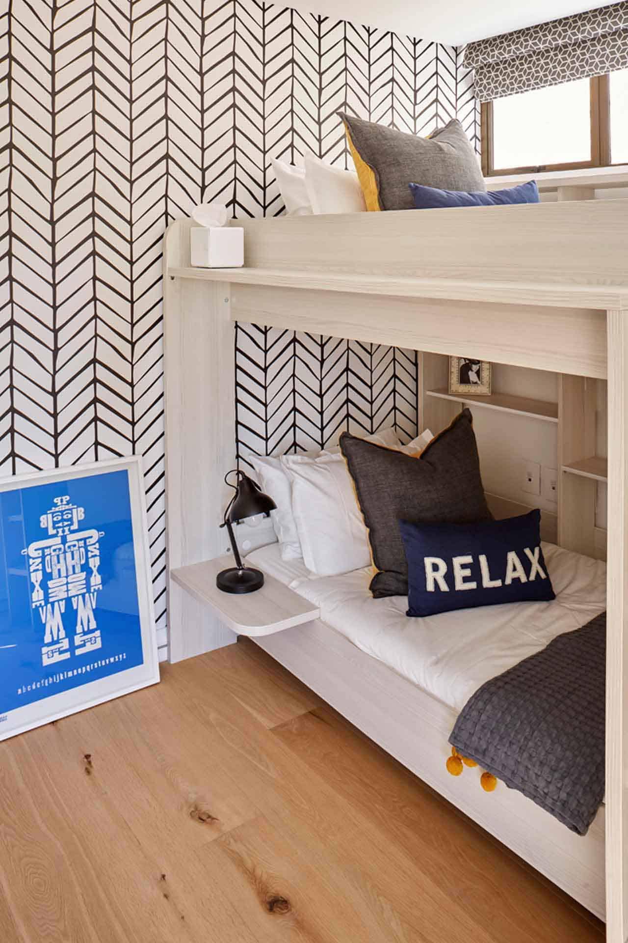 The wallpaper features a striking black and white herringbone pattern.