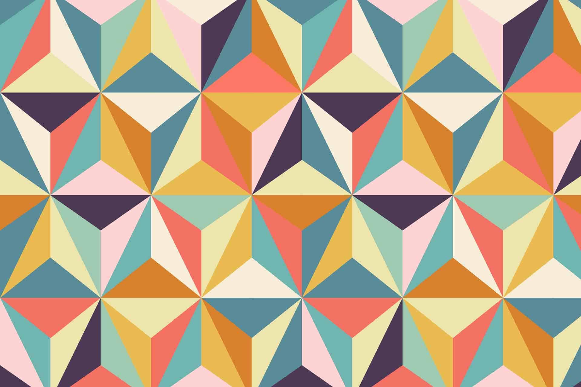 A seamless geometric pattern of multicolored triangles and diamonds forms a repetitive, tessellating design. The vibrant pattern features shades of pink, blue, yellow, orange, and green, symbolizing diversity and creativity. This dynamic wallpaper exudes energy with its bold shapes and striking colors.