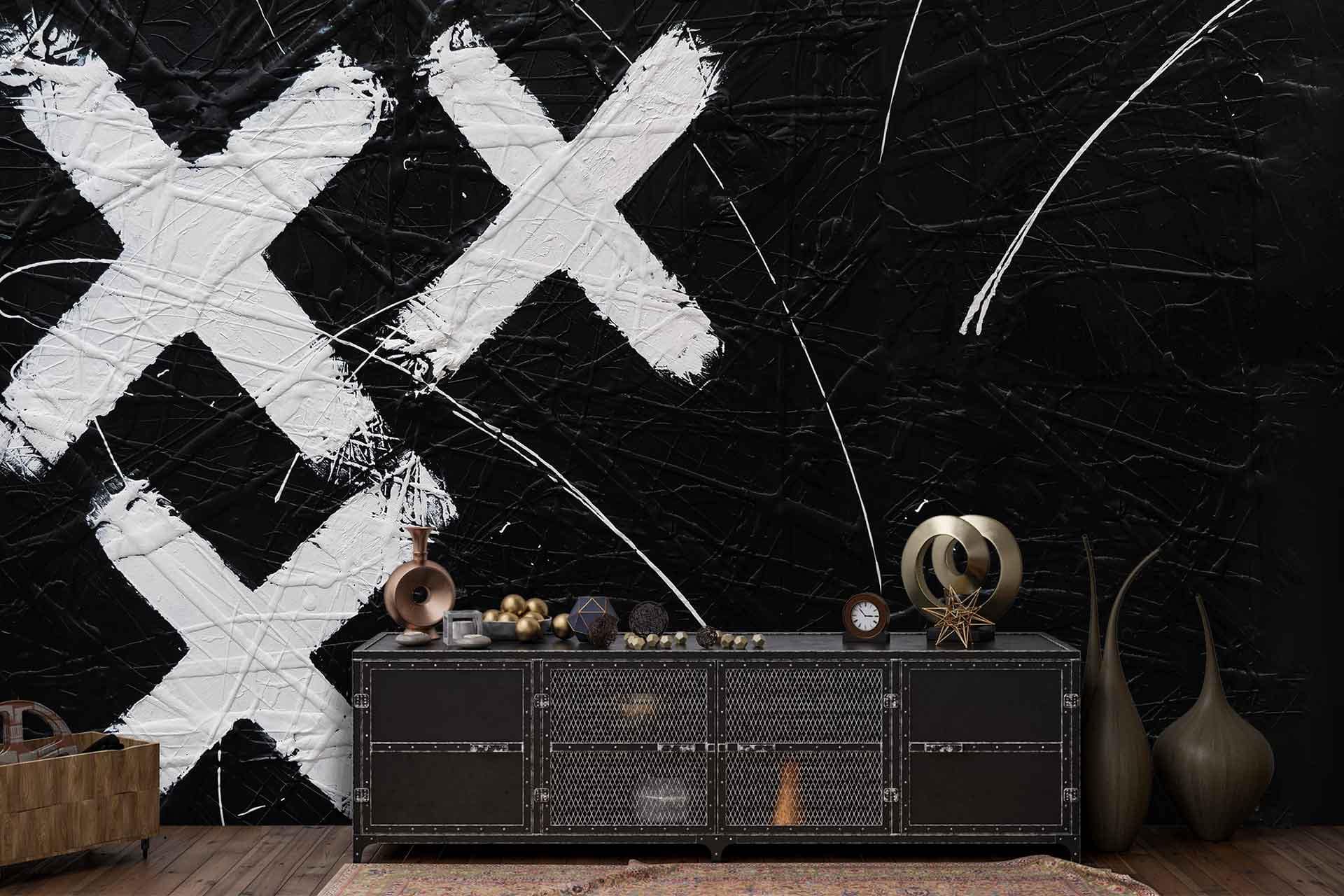 Black wall with large white Xs and abstract white lines.