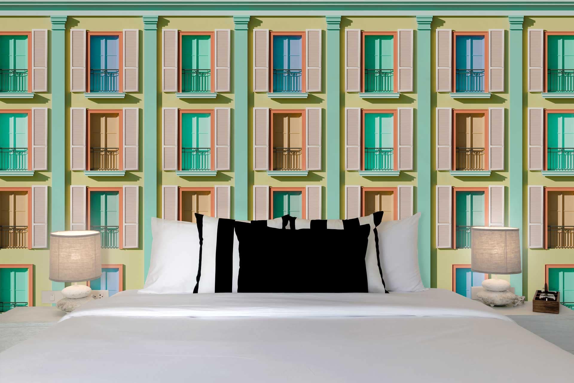 The wallpaper features a vibrant, colorful pattern of windows with balconies in hues of blue, yellow, red, and green, creating a lively and artistic backdrop.