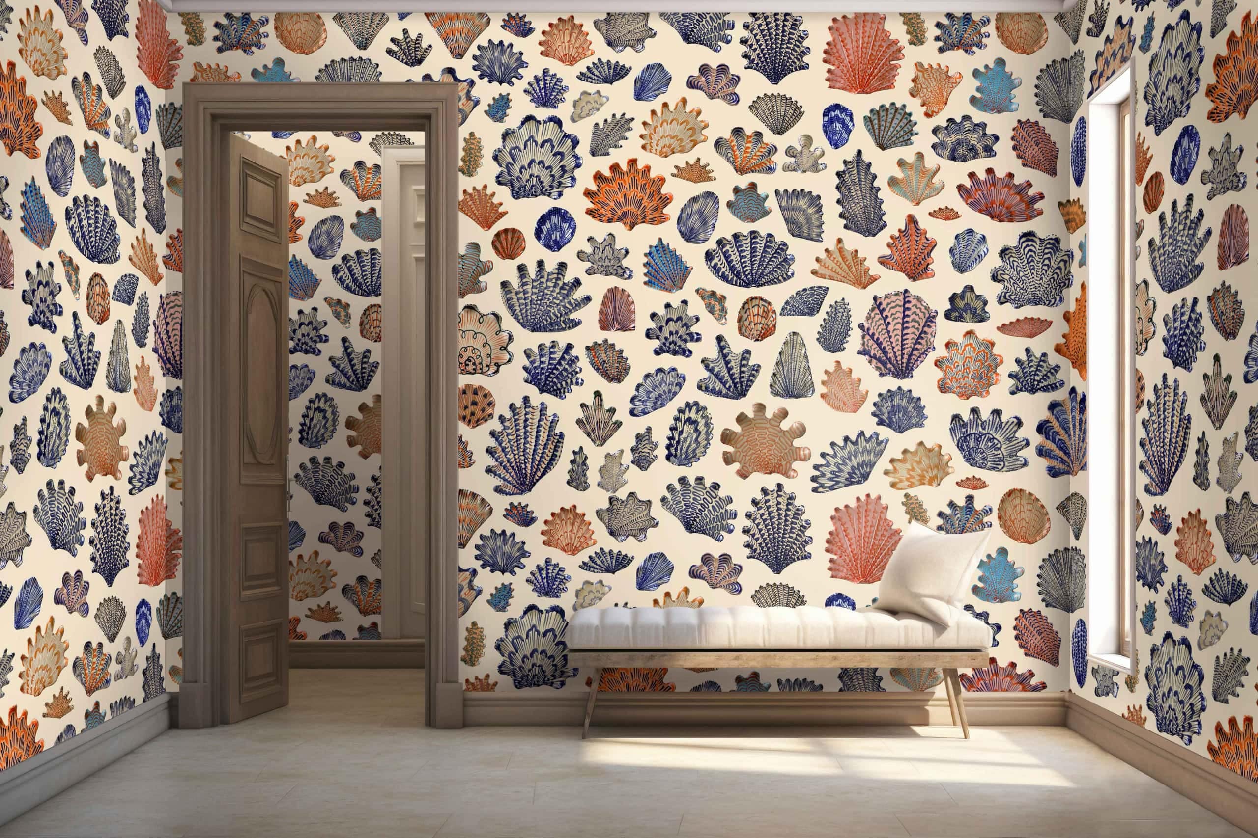 A room with walls covered in colorful, coral-patterned wallpaper featuring shades of orange, blue, and beige. The intricate coral designs intertwine with varying hues of these colors, creating a vibrant and lively atmosphere.