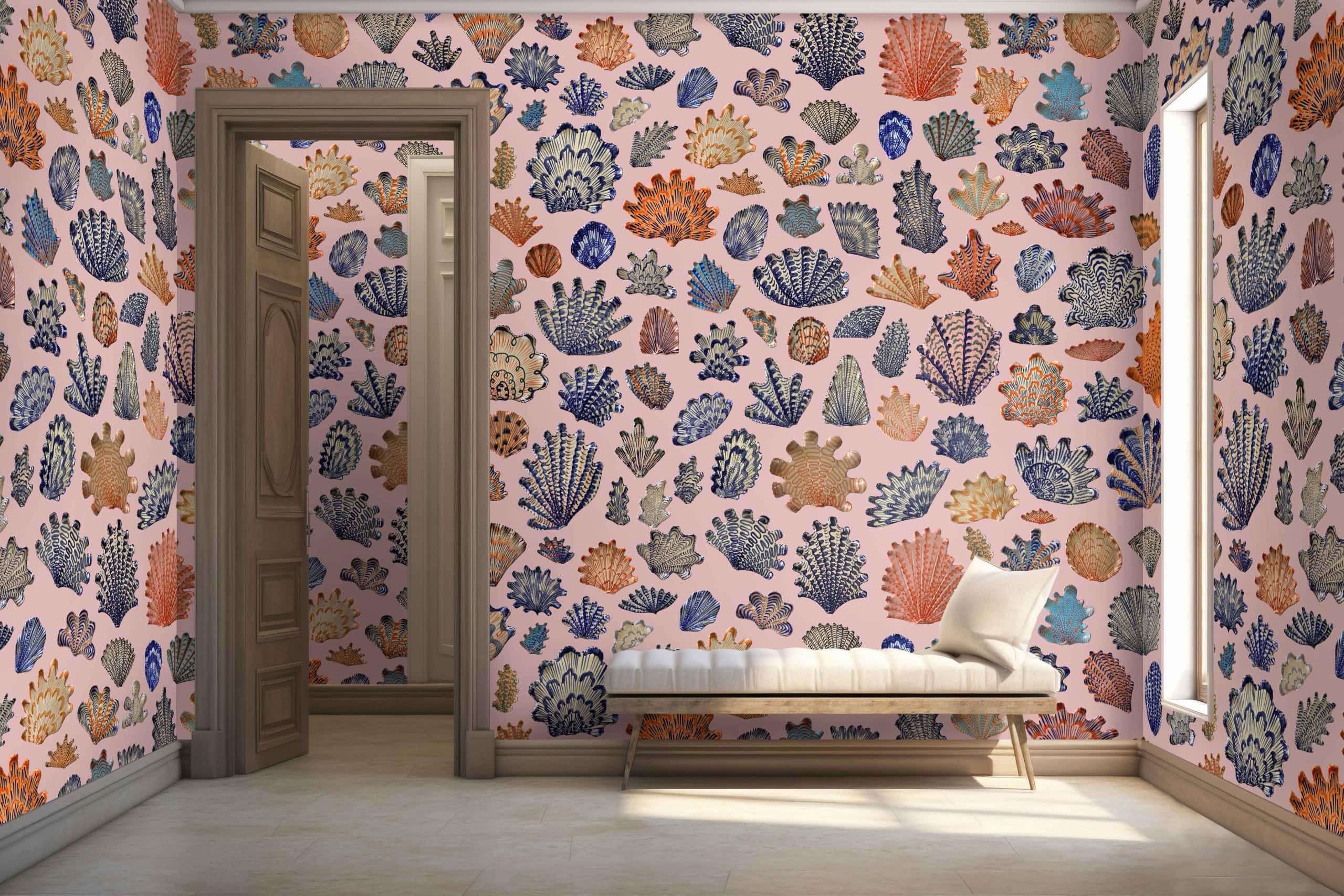 A vibrant room showcases walls adorned with colorful, intricate coral-themed wallpaper. The design features an array of marine elements: vivid corals in shades of red, orange, and pink interwoven with turquoise seaweed and golden starfish. Soft lavender seashells add a delicate contrast, while bubbles in varying sizes create a whimsical touch. This lively underwater scene is illuminated by the sunlight streaming through the window.