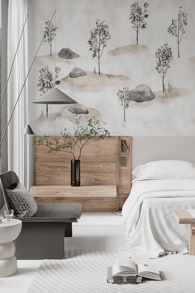 The wallpaper in the minimalist bedroom features a mural of trees and rocks. The colors include shades of green from the trees, earthy browns and grays from the rocks, and subtle shadows to add depth. This natural scene is bathed in the soft glow of a Coral Moon, introducing calming coral hues throughout.