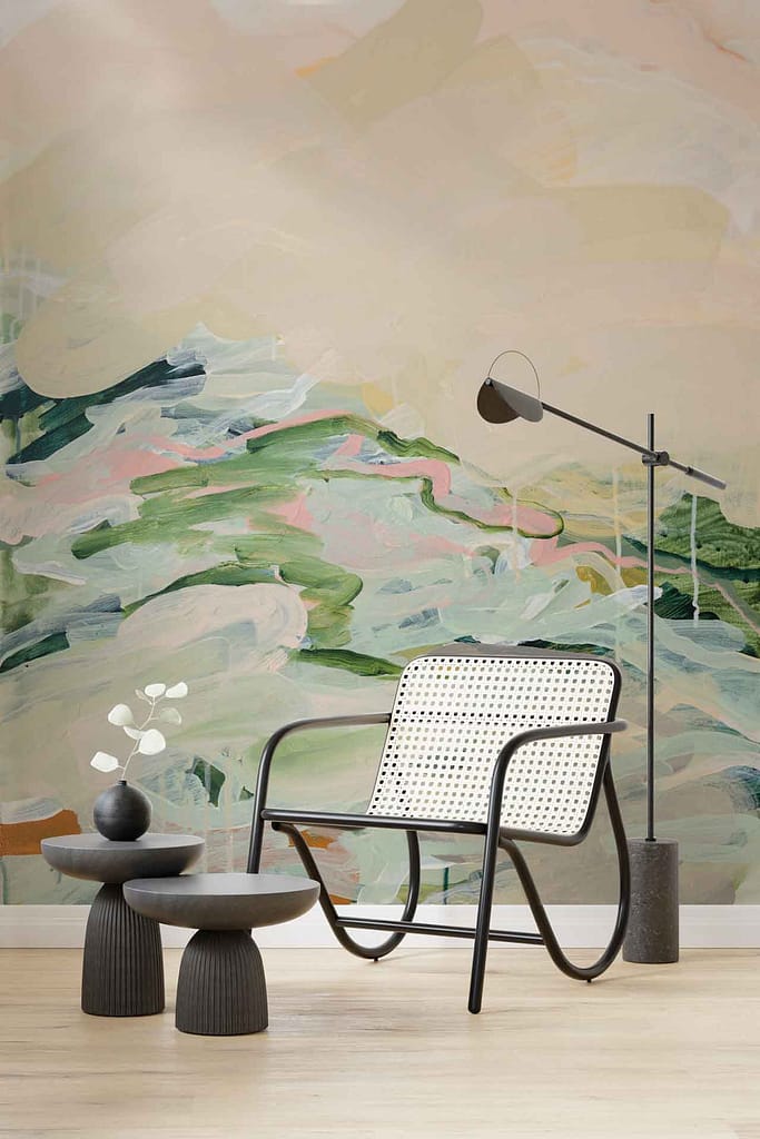Abstract multicolored wall mural, pastel shades of green, pink, and beige, dancing across the surface.