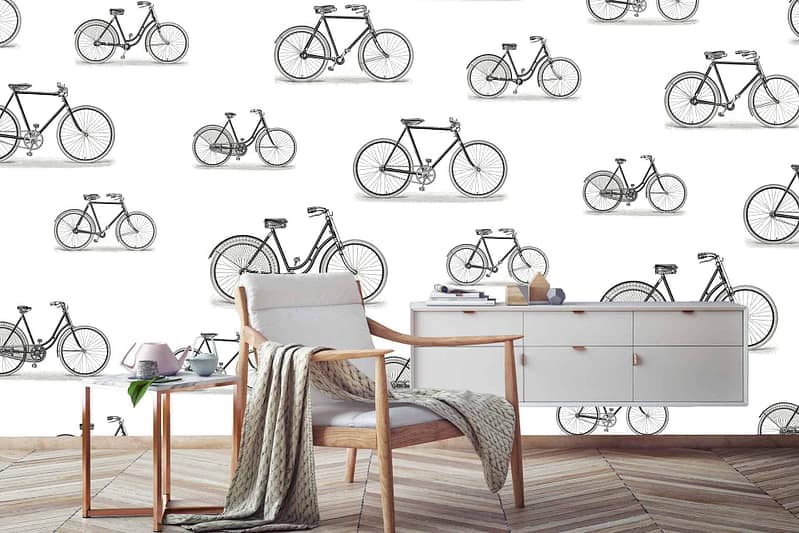 Vintage bicycle races wallpaper features classic bicycles, riders in motion, muted earth tones, sepia accents, retro uniforms in hues of navy and burgundy, weathered textures, rustic charm.