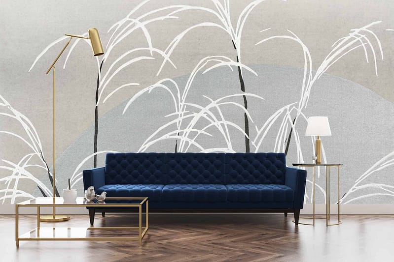 The neutral-tone wall is adorned with a large abstract mural featuring white arching lines resembling tall grasses or leaves.