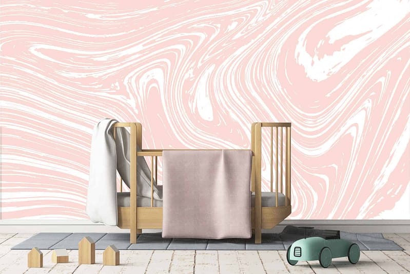 The wallpaper in the children's room is pink and white marbled, reminiscent of a strawberry milkshake. The design features swirling patterns and shades of soft pink blending with bright white.