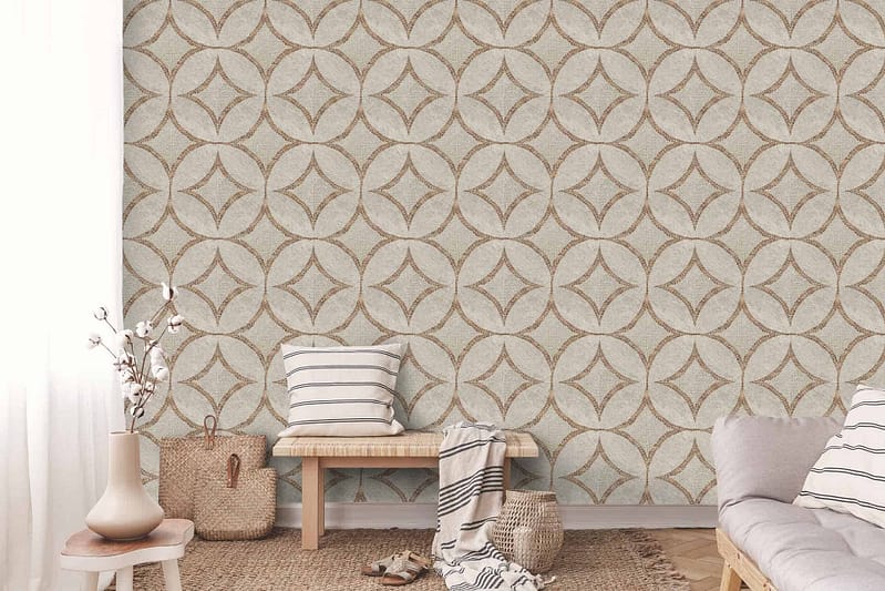 A cozy living area with a patterned feature wall displaying a geometric design in beige and light brown. The wallpaper features intricate shapes in warm, earthy tones, combining soft beige and various shades of light brown to create a harmonious and inviting atmosphere.